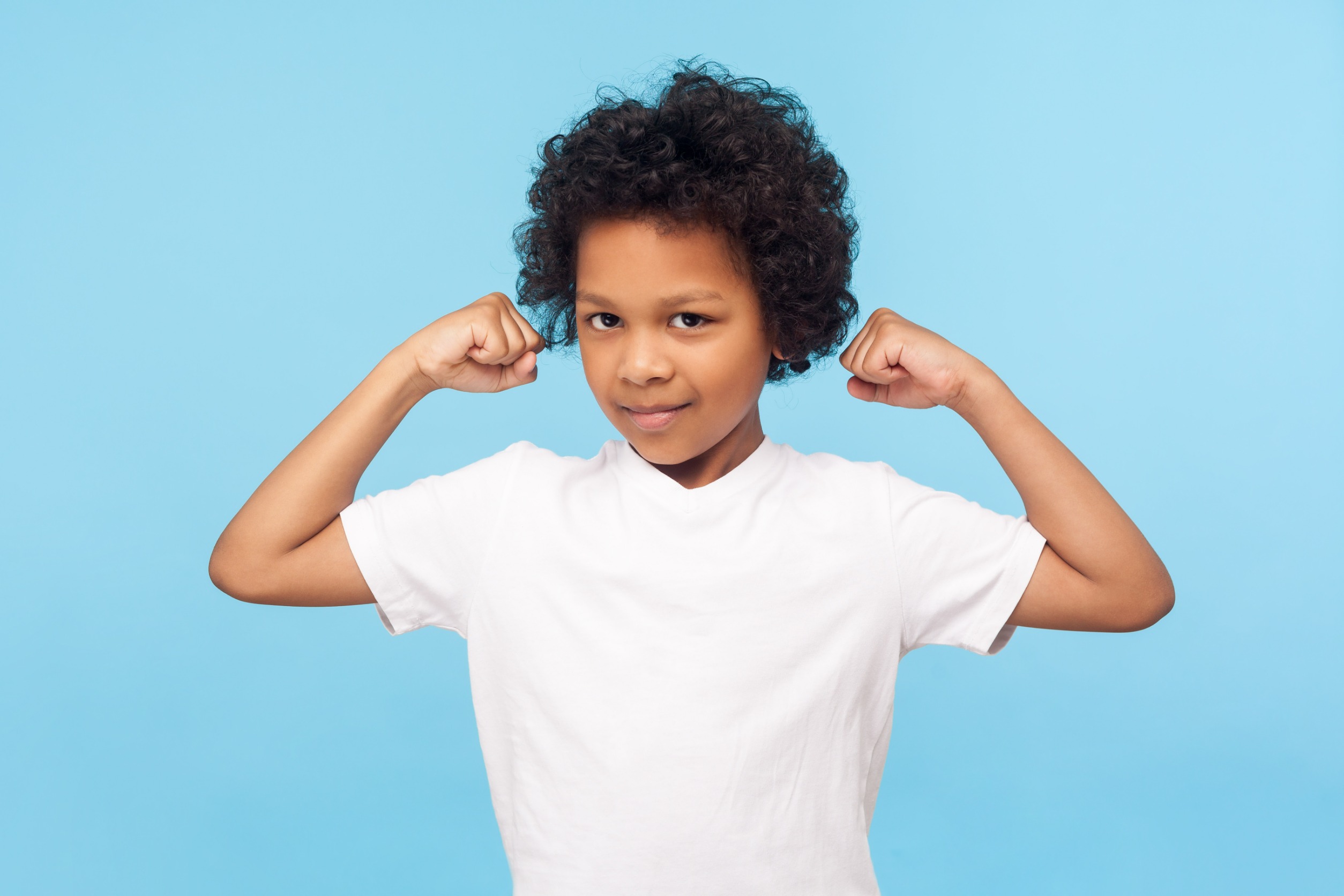 Youngster flexing muscles
